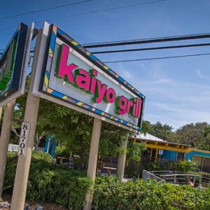 exterior of kaiyo grill and sushi with sign at foreground