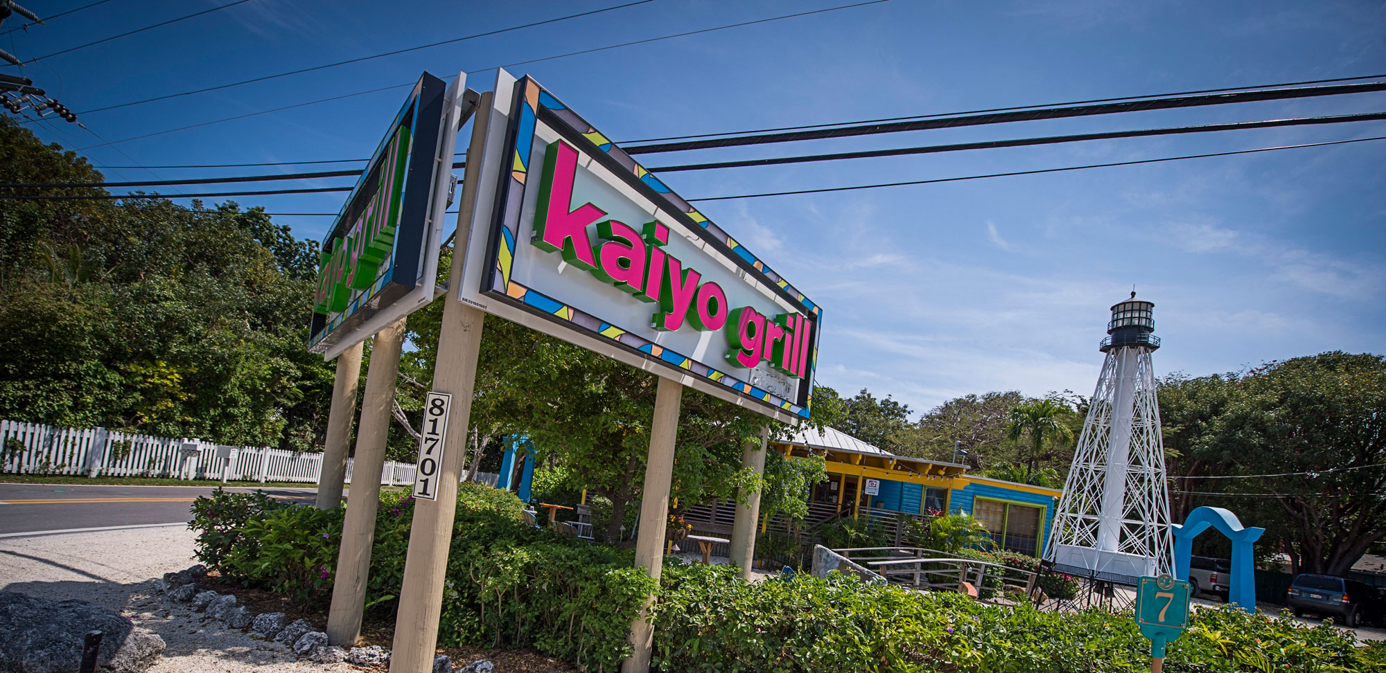 exterior of kaiyo grill and sushi with sign at foreground